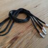 Paire de lacet noire embouts blanc