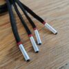 Paire de lacet noire embouts blanc