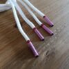 Paire de lacet blanc embouts rose
