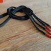 Paire de lacet noire embouts rouge