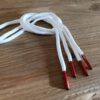 Paire de lacet blanc embouts rouge