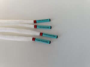Paire de lacet blanc embouts turquoise