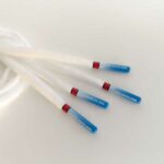 Paire de lacet blanche embouts nation