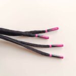 IMG_20250428_120253 Paire de lacet noire embouts Pink-fade