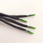 IMG_20250428_120702 Paire de lacet noire embouts Green-fade