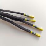 IMG_20250428_175748 Paire de lacet noire embouts Yellow-fade